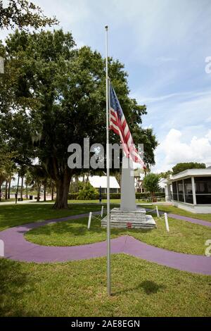 american flag flying at half-staff kissimmee memorial park outside american legion building kissimmee florida usa