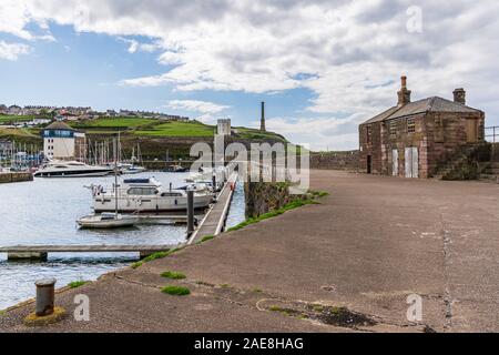 Whitehaven, Cumbria, England, UK - May 03, 2019: View from the end of the Old Quay towards the Harbour and the Candlestick Chimney. Stock Photo