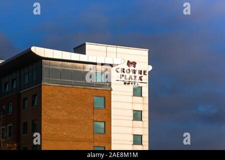 BIRMINGHAM, ENGLAND - DECEMBER 2019: Sign on the outside of the Crowne Plaza Hotel at the Birmingham National Exhibition Centre. Stock Photo