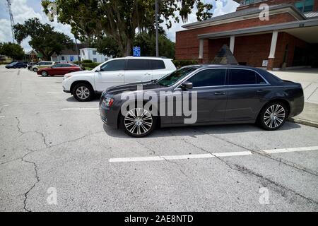 cars parked in back-in angle parking only on street kissimmee florida usa Stock Photo