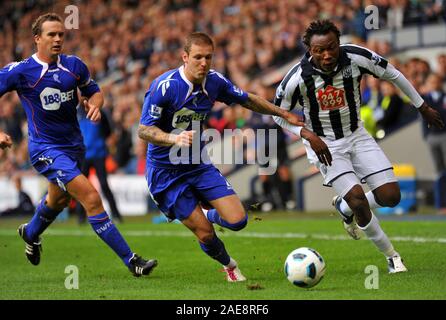 25th September 2010 - Premier League Football - West Brom Albion Vs Bolton - WBA's Somen Tchoyi gets into a race for the ball with Bolton's Gretar Rafn Steinsson.  Photographer: Paul Roberts / OneUpTop/Alamy. Stock Photo