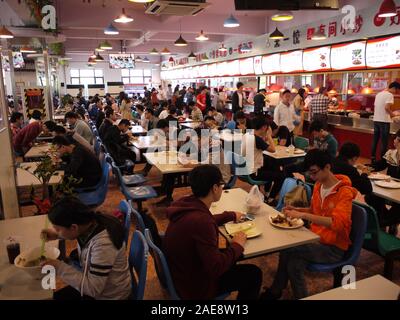 Students eat at the canteen of Tsinghua University in Beijing Stock Photo