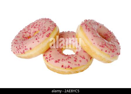 x?Group of three pink glazed donuts isolated on white background. Stock Photo