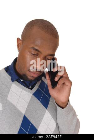A very handsome young African American man in a close-up image talking on his cellphone, isolated for white background Stock Photo