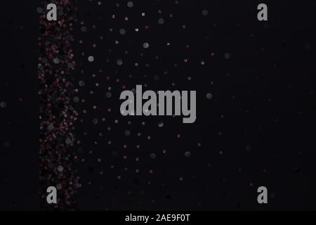 Beautiful black fabric with colorful plastic decoration and textile texture background Stock Photo