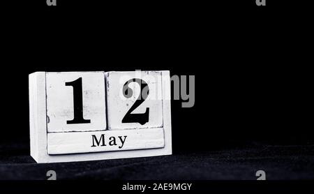 May 12th, Twelfth of May, Day 12 of month May - vintage wooden white calendar blocks on black background with empty space for text Stock Photo
