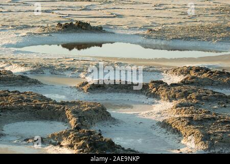 Pool of water in salt pan, with reflection, in Alviso, San Jose, California.  wildlife refuge where marshlands are being restored & returned to nature Stock Photo