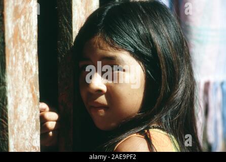 A young, indigenous, ethnic Huaorani girl in her village near Tiguino, Orellana Province, Ecuador. Stock Photo