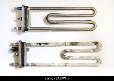 old and new washing machine heater Stock Photo