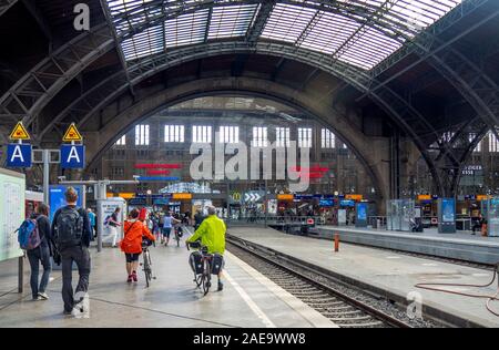 Touring cyclists and other passengers on platform of Leipzig Hauptbahnhof Central Train Station Leipzig Saxony Germany Stock Photo