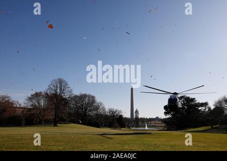 Washington DC, USA. 07th Dec, 2019. The Marine One helicopter blows leaves on the South Lawn of the White House in Washington before President Donald Trump's departure to Fort Lauderdale, Florida on December 7, 2019. Credit: MediaPunch Inc/Alamy Live News