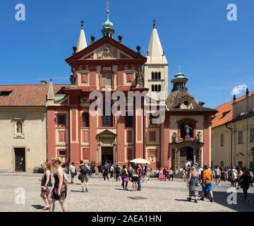 St George's Basilica  and tourists in Saint George's Square Prague Castle Complex Prague Czech Republic.