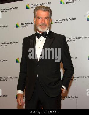 Washington DC, USA. 07th Dec, 2019. Pierce Brosnan arrives for the formal Artist's Dinner honoring the recipients of the 42nd Annual Kennedy Center Honors at the United States Department of State in Washington, DC on Saturday, December 7, 2019. The 2019 honorees are: Earth, Wind & Fire, Sally Field, Linda Ronstadt, Sesame Street, and Michael Tilson Thomas.Credit: Ron Sachs/Pool via CNP Photo via Credit: Newscom/Alamy Live News