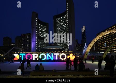 TORONTO - DECEMBER 2019:  Civic square and skating rink in front of Toronto City Hall is brightly lit with Christmas decorations each year. Stock Photo