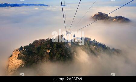 Huayin. 8th Dec, 2019. The undated file photo shows the Taihua cableway in Mount Huashan, northwest China's Shaanxi Province. To keep the cableway running safely and efficiently, the annual maintenance of Taihua cableway for Mount Huashan has been carried out since Nov. 25 and will last until Dec. 15. Taihua cableway, which was opened to public in 2013, provides the stunning view of Mount Huashan, known for its steep peaks, for the visitors. Credit: Xinhua/Alamy Live News Stock Photo