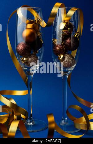 champagne glasses with golden ribbon and sparkles - new year ...