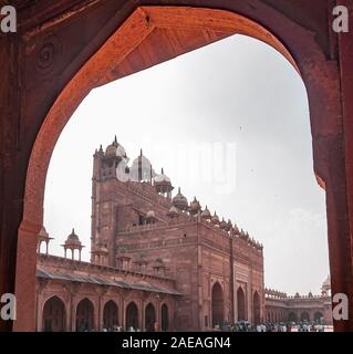 In frame Buland Darwaza or the 'Gate of victory', was built in 1601 A.D. by Mughal emperor Akbar to commemorate his victory over Gujarat. Stock Photo