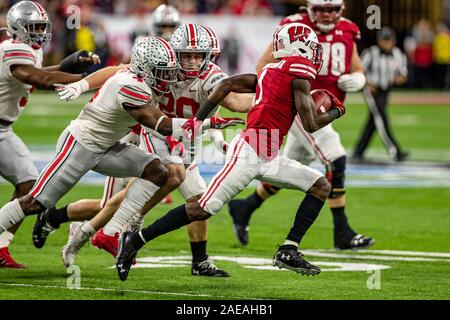 Indianapolis, Indiana, USA. 7th Dec, 2019. Wisconsin Badgers wide receiver Aron Cruickshank (1) carries the ball in the first half of the game between the Wisconsin Badgers and the Ohio State Buckeyes at Lucas Oil Stadium, Indianapolis, Indiana. Credit: Scott Stuart/ZUMA Wire/Alamy Live News Stock Photo