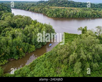 Aerial view of boat in the mangrove Rio Sierpe river in Costa Rica deep inside the jungle. Stock Photo