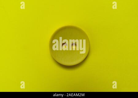 Big black button isolated on a black background. Stock Photo