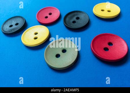 Large multi-colored buttons on a blue background. Stock Photo