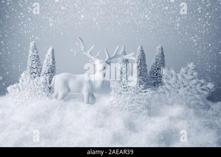 Christmas trees, deer and snowflake on abstract background Stock Photo