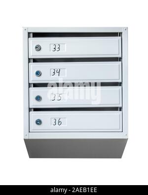 Group of mailboxes with apartment numbers isolated on a white background. Stock Photo