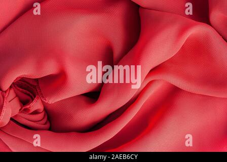 Artistic fabric texture background of red silk silk cloth red color. Stock Photo