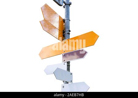 Blank road signs in yellow, white and brown colors, hung on a metal pole showing different directions, isolated on a white background with a clipping Stock Photo