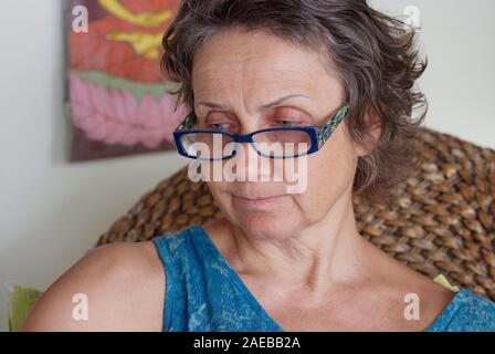 close up portreit of mature woman relaxing in a villa in Thailand Stock Photo
