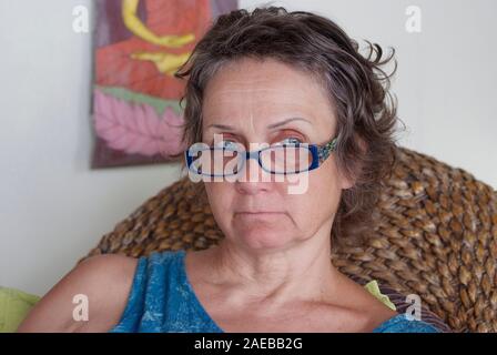 close up portreit of mature woman relaxing in a villa in Thailand Stock Photo