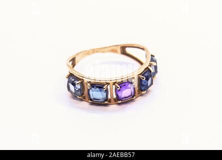 Gold ring with precious stones isolated on white Stock Photo