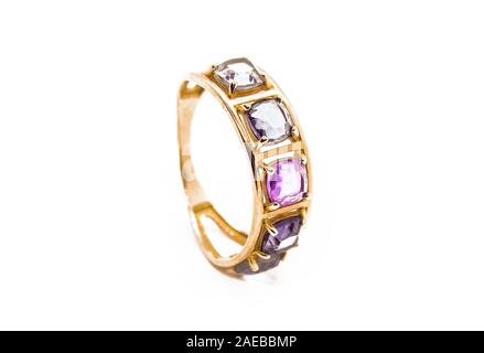 Gold ring with precious stones isolated on white Stock Photo