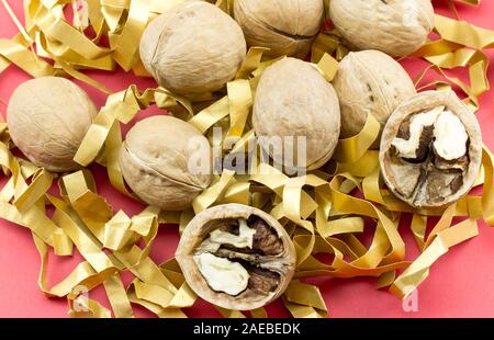 Walnuts with and without shells. Background of fresh walnuts. Stock Photo