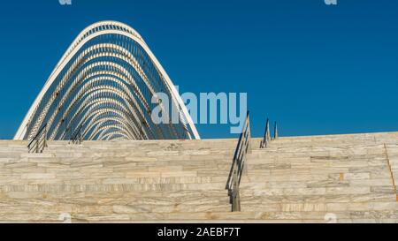 White marble staris with guardrails in foreground with Arched monument at 2004 Oympic Complex in Athens, Greece Stock Photo