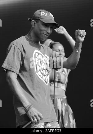 LONDON - JUL 02, 2016: Image digitally altered to monochrome Pharrell Williams performs at the Barclaycard British Summer Time Event in Hyde Park on Jul 02, 2016 in London Stock Photo