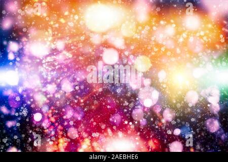 Flying snowflakes on a light blue background. Winter Abstract snowflakes. Falling snow. Stock Photo