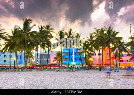 Miami Beach, Florida, USA cityscape with art deco buildings on Ocean Drive at twilight.