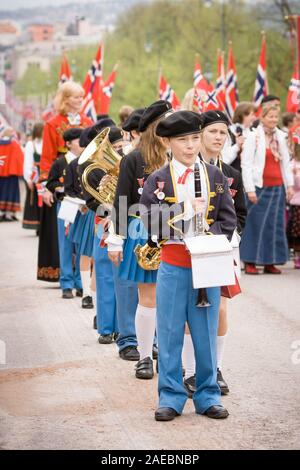 Oslo, Norway - May 17, 2010: National day in Norway. Norwegians at traditional celebration and parade on Karl Johans Gate street. Stock Photo