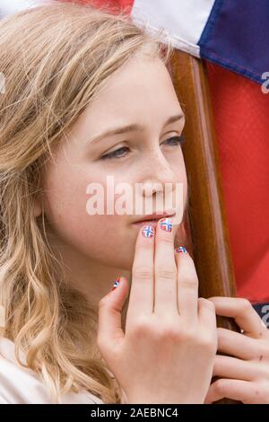 Oslo, Norway - May 17, 2010: National day in Norway. Norwegian girl at traditional celebration and parade on Karl Johans Gate street. Stock Photo