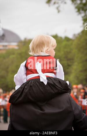 Oslo, Norway - May 17, 2010: National day in Norway. Norwegian girl at traditional celebration and parade on Karl Johans Gate street. Stock Photo