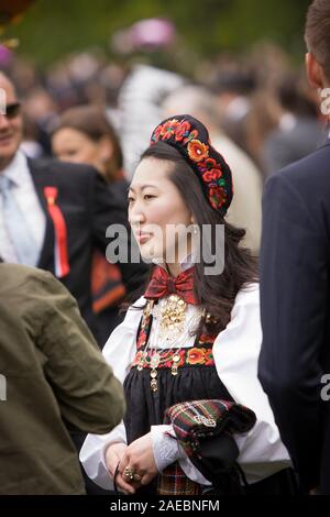 Oslo, Norway - May 17, 2010: National day in Norway. Norwegians at traditional celebration and parade on Karl Johans Gate street. Stock Photo