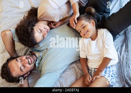 Happy family having fun times at home Stock Photo