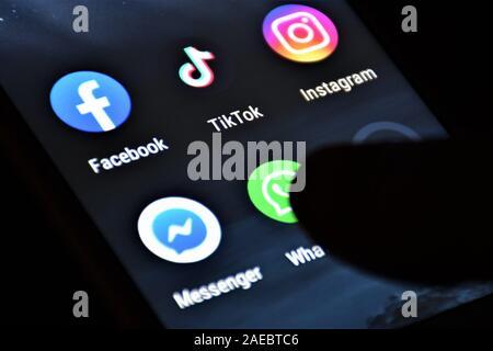 Close up view of the TikTok logo, app icon, logo displayed on a modern smartphone with other various apps Stock Photo