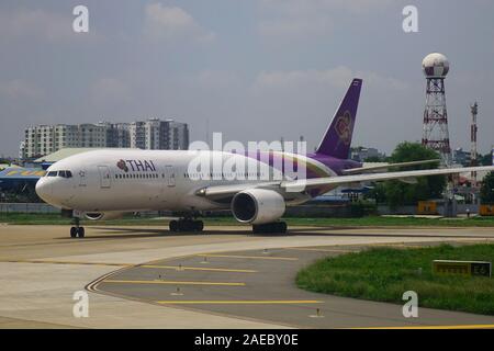 Saigon, Vietnam - May 22, 2019. Thai Airways HS-TJG (Boeing 777-200) taxiing on runway of Tan Son Nhat Airport (SGN) in Saigon, Vietnam. Stock Photo