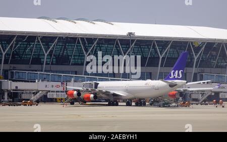 Shanghai, China - Jun 3, 2019. OY-KBC SAS Scandinavian Airlines Airbus A340-300 docking at Shanghai Pudong Airport (PVG). The airport is the busiest g Stock Photo