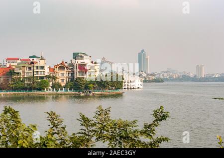View across West Lake in Ho Tay District with hazy smog, Hanoi, Vietnam, Southeast Asia Stock Photo