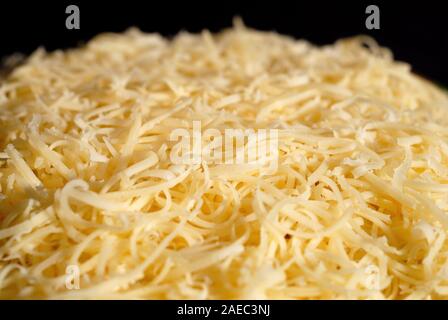 Salad seasoned with mayonnaise and sprinkled with grated cheese. Shallow depth of field Stock Photo