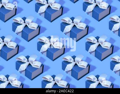Pattern made of blue gift boxes on pastel background. Stock Photo