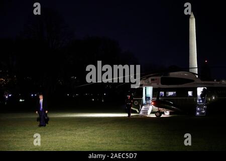 Washington DC, USA. 08th Dec, 2019. United States President Donald J. Trump walks on the South Lawn of the White House upon his return to Washington from Florida on December 7, 2019. Credit: MediaPunch Inc/Alamy Live News Stock Photo